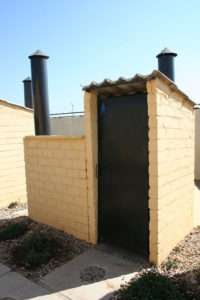 Image used under a Collective Commons License from: https://commons.wikimedia.org/wiki/File:Outside_Otji_toilet_(5201185500).jpg